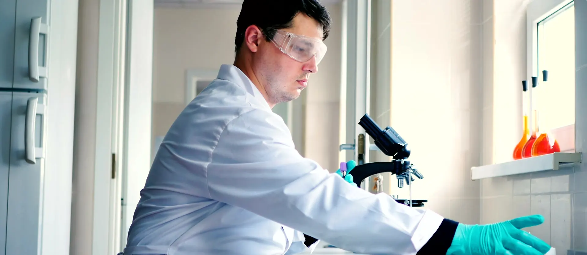 A scientist preparing samples in a laboratory