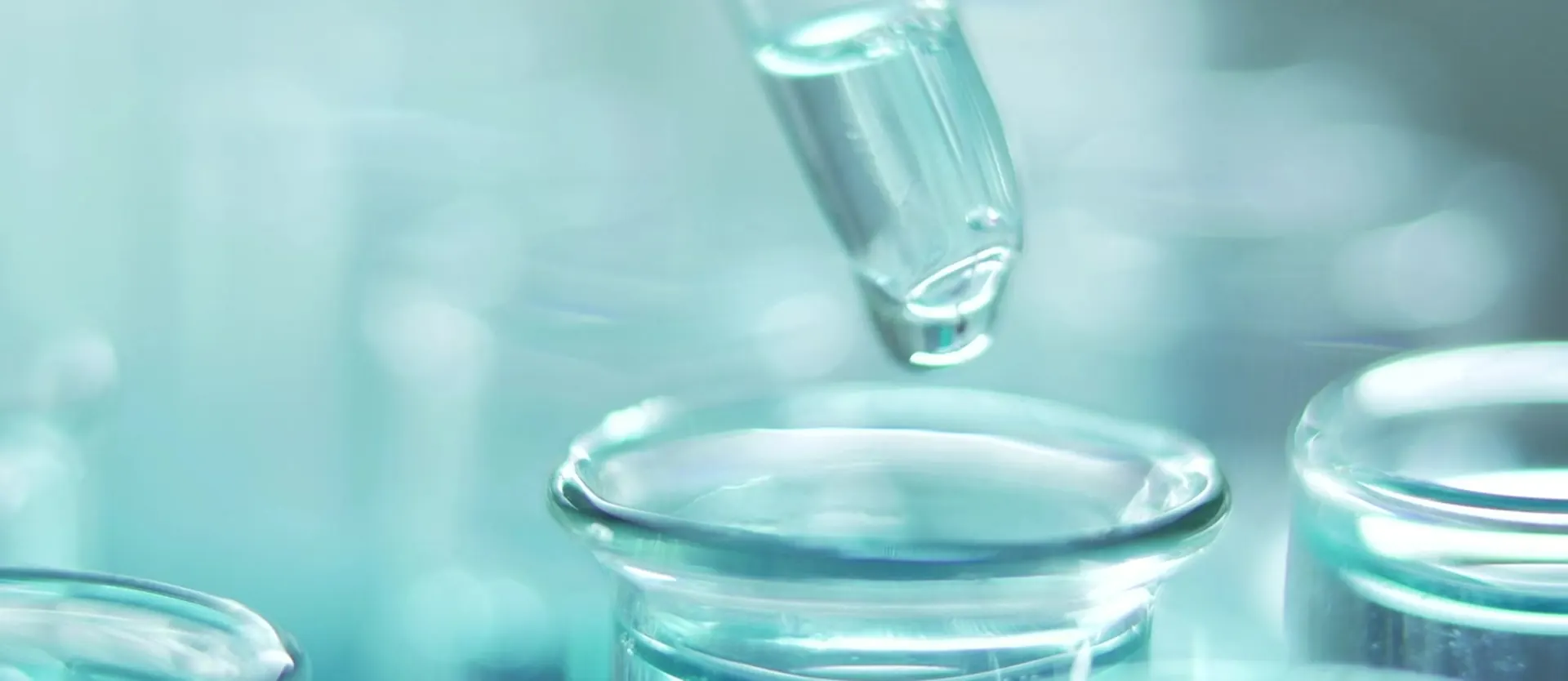 Drops falling into laboratory glassware